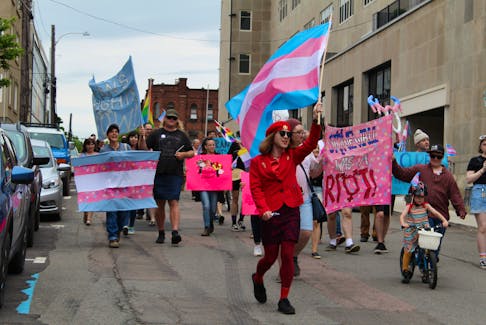 Participants march in support of transgender rights during Charlottetown’s first Stonewall March held on Saturday. Those in attendance marched through the city waving flags and signs to support transgender people as well as commemorate the 50th anniversary of the Stonewall riots. KATHERINE HUNT/THE GUARDIAN