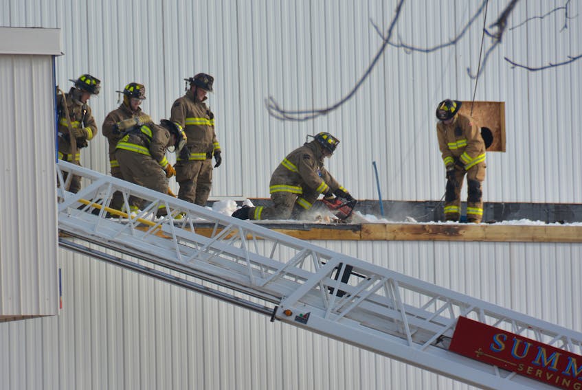 Summerside firefighters had to cut open a section of roof on the ADL plant in Summerside on Thursday to fight a small fire.