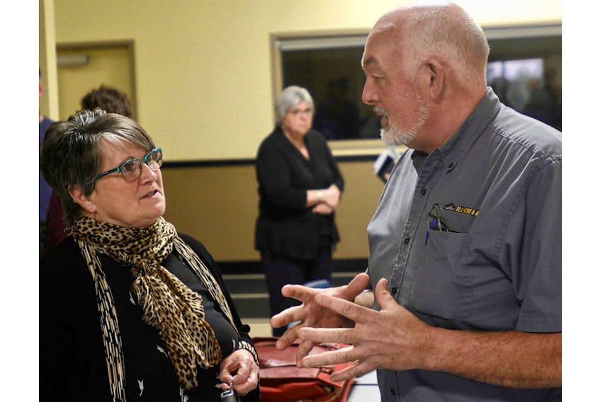 Three Rivers Coun. Cindy MacLean, left, and Coun. David McGrath chat following council’s monthly meeting Monday.