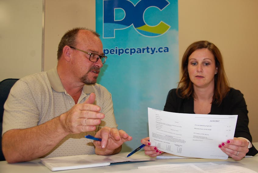 Margaret Ann Walsh, interim president of the Progressive Conservative Party of P.E.I., and party executive director Craig Davidson review the agenda for Friday’s PC leadership convention and annual general meeting. JIM DAY/THE GUARDIAN