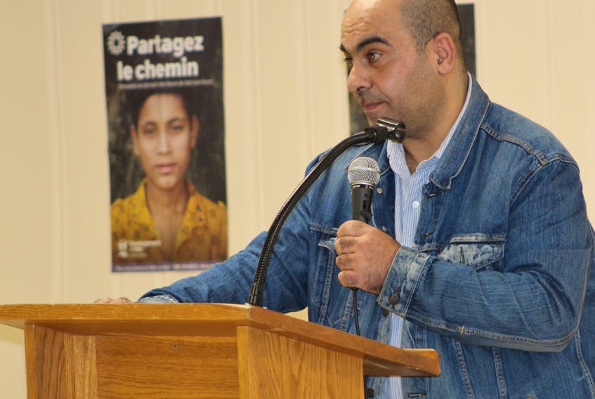 Wisam Abou Assali, who came to Canada in September 2016 after fleeing Syria with his family, speaks during a workshop for the diocese of Charlottetown council of development and peace on Sunday.