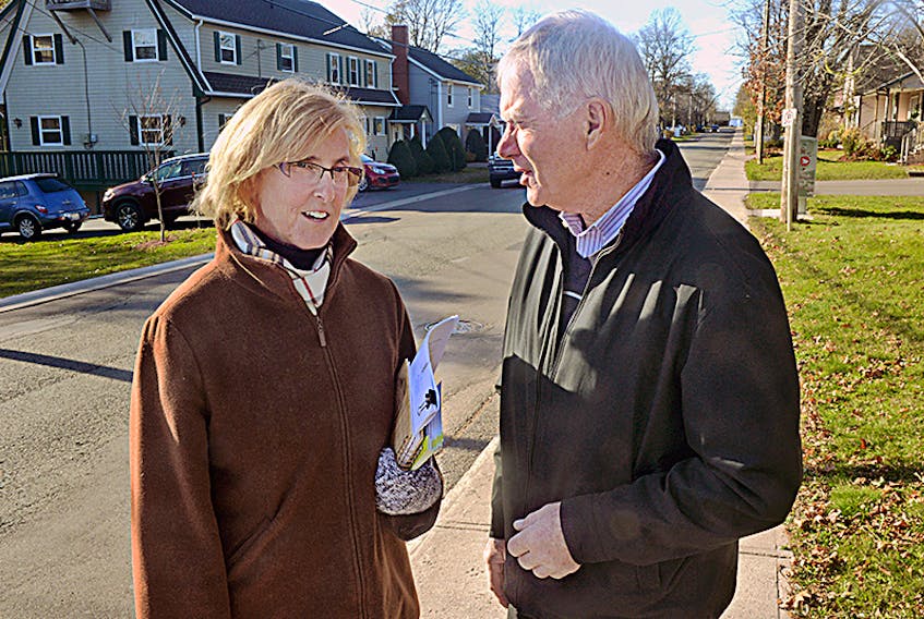 Progressive Conservative party candidate Melissa Hilton chats with supporter Chester Gillan, who is also a former PC cabinet minister, while campaigning earlier this month. Hilton says her 12 years of experience in Charlottetown city council will be an asset in the provincial legislature.  ©THE GUARDIAN