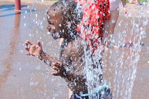 Jonathan Prince Ingenzi, 3, of Charlottetown cools off at the splash pad at Victoria Park on a hot Thursday afternoon.