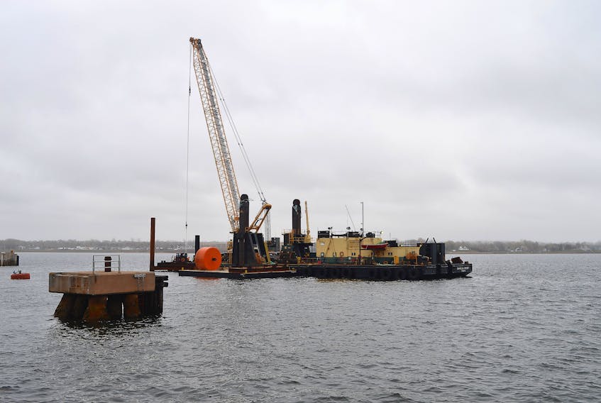 A massive crane is shown just off Confederation Landing Park in Charlottetown on Monday, where work is continuing on part of a $12-million wharf expansion that has been in full swing since last June. The berth expansion project will extend the existing berth at Port Charlottetown by 270 metres, which will allow for two vessels up to 330 metres long to berth at the same time. To put those numbers in perspective, the Holland America cruise ship Veendam, a frequent visitor to Charlottetown, is 219 metres long. The project is scheduled to be completed this fall. Dave Stewart/The Guardian