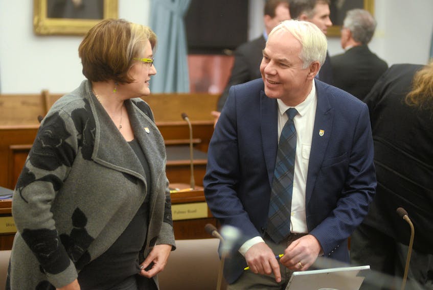 Green Party Leader Peter Bevan-Baker, right, chats with Green MLA Hannah Bell before question period. Last week, Bevan-Baker said the province’s carbon reduction plan would only subsidize fossil fuel use rather than provide an incentive to reduce it.