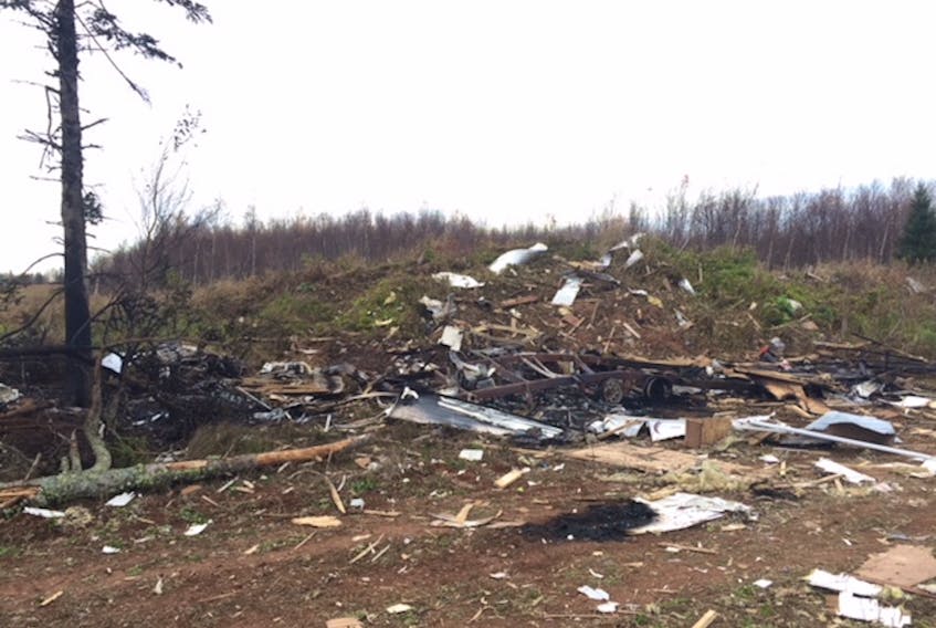 A passer-by took this photo of what used to be a 30-foot travel trailer that exploded in the back part of a farmer’s field near Hampshire on Saturday. The RCMP is investigating the matter. (Submitted photo)