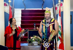 New poet laureate of Prince Edward Island, Julie Pellissier-Lush, performs some traditional Mi’kmaq music with her son, Richard Pellesier-Lush, during a ceremony at Government House on Monday.