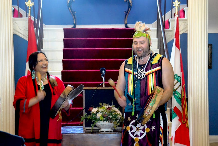 New poet laureate of Prince Edward Island, Julie Pellissier-Lush, performs some traditional Mi’kmaq music with her son, Richard Pellesier-Lush, during a ceremony at Government House on Monday.