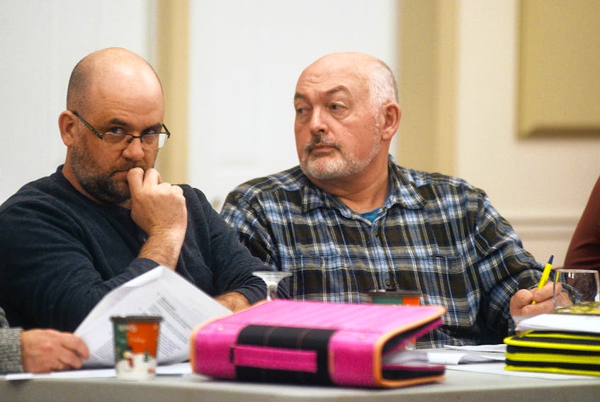 Coun. Alan Munro, left, and Coun. David McGrath listen to a presentation during Monday’s Three Rivers council meeting at Kings Playhouse. Council will be weighing all the area’s needs and priorities before making any major decisions.