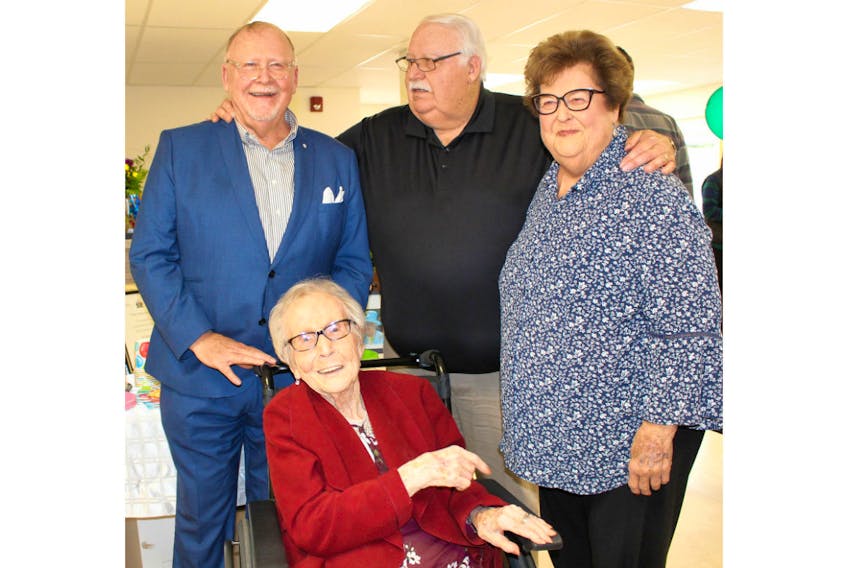 Helen Stetson, seated, celebrated her 100th birthday with family and friends at the Atlantic Baptist Home on Sunday. Shown with Stetson are, from left, sons and daughter Kent Stetson, Paul Stetson and Elizabeth Rowe.