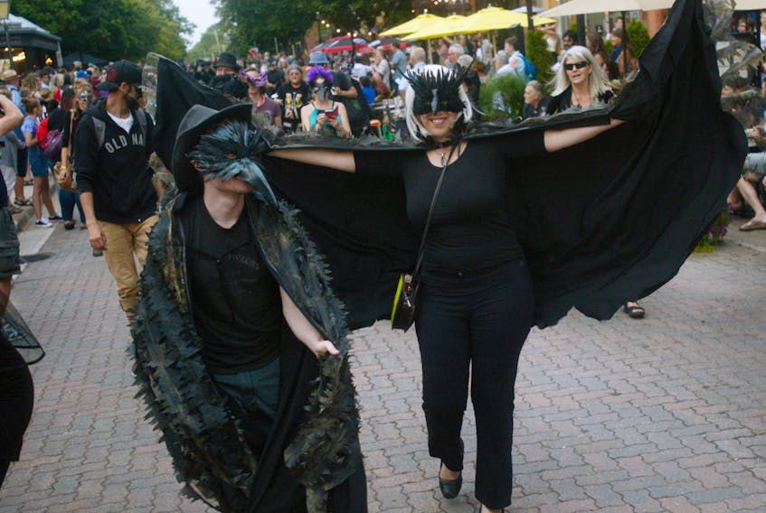 Participants in the March of the Crows make their way down Victoria Row on Saturday. Every year, the march draws out hundreds of participants and spectators.