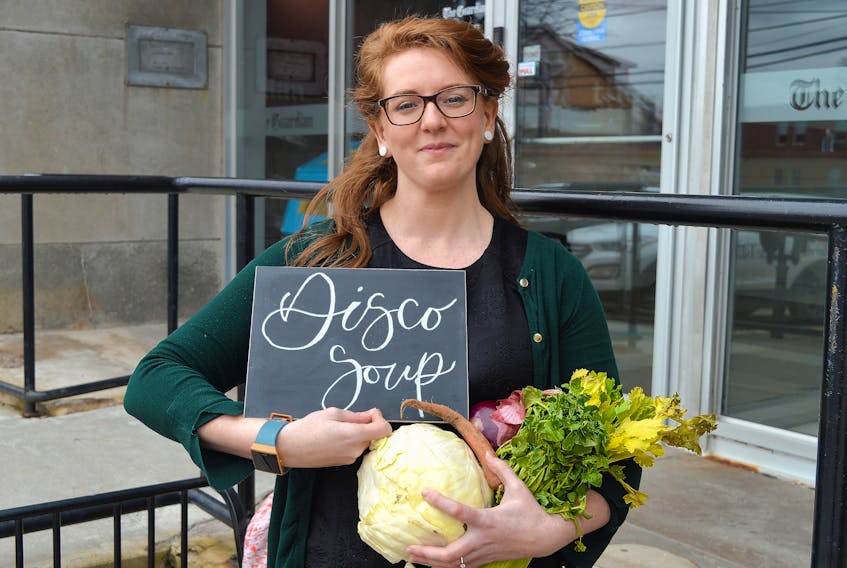 Kendra Mellish, a volunteer and board member with Fusion Charlottetown, holds a red onion, cabbage, carrot, celery and some greens that would likely be considered unfit to sit on a grocery store shelf but are perfectly safe to eat. Fusion Charlottetown and the P.E.I. Food Exchange recently received a micro-grant from the City of Charlottetown to host a Disco Soup event this fall to bring awareness to food waste.