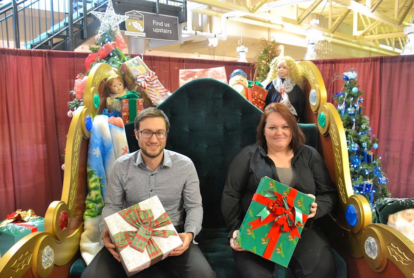 Jay Noble, marketing co-ordinator, and his colleague, Barb Chisholm, are setting up Santa’s area at Confederation Court Mall in time for the fourth annual Victorian Christmas Weekend, beginning today and running until Nov. 25 in Charlottetown.