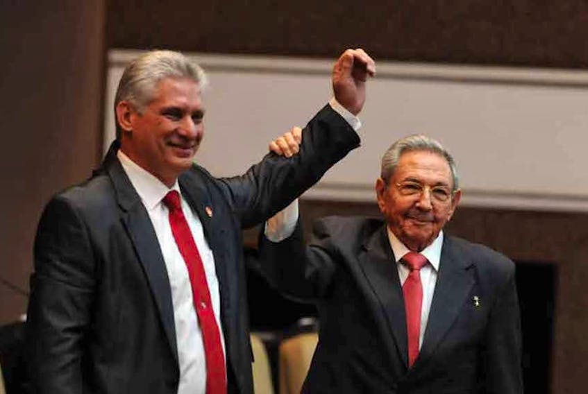 The Cuban Parliament elected Miguel Diaz-Canel, left, as president of the State Council for a term of five years, the National Electoral Commission announced in Havana April 19. He replaces Raul Castro, (shown offering his support) and brother of former dictator Fidel Castro, as president. 

(Prensa Latina)