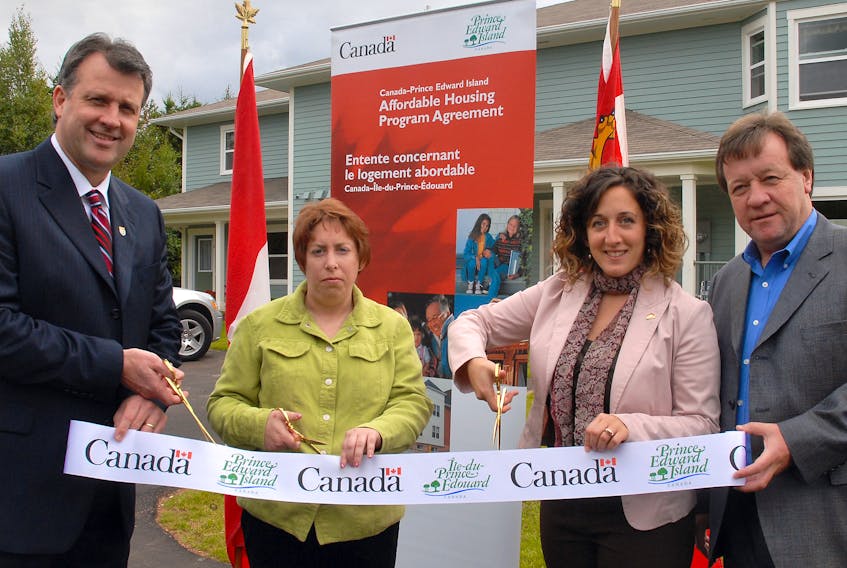Social Services and Seniors Minister Doug Currie, left, joins Kristen Callaghan, a tenant of Life Bridge; Caroline Arsenault, Canada Mortgage and Housing Corporate Representative, Life Bridge Inc. and Mayor Clifford Lee of the City of Charlottetown in officially opening Life Bridge, an affordable housing project on Beach Grove Road in Charlottetown. 

(File photo)