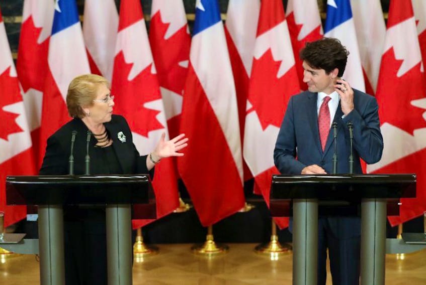 Canadian Prime Minister Justin Trudeau and Chilean President Michelle Bachelet announced new federal programs in both countries designed to promote gender equality in the workforce. The two met in June 2017.

 (AFP Photo)