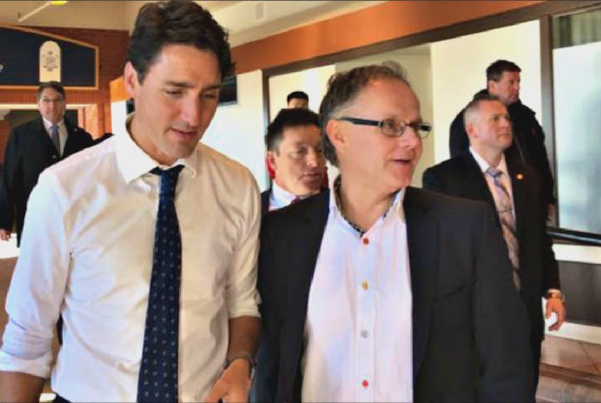 Saint John – Rothesay Liberal MP Wayne Long, right, broke ranks with his party on tax reform and was removed from two Commons committees for his trouble by Prime Minister Justin Trudeau, left.
 (Facebook.com/waynelong)