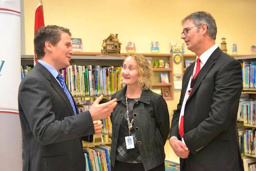 Education Minister Jordan Brown, left, Marilyn MacLean, principal at West Royalty Elementary School, and Parker Grimmer, director of the Public Schools Branch discuss the province’s plans to tackle the waiting list for psychological assessments in P.E.I. 

(Guardian File Photo / Teresa Wright)