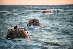 Boats laden with lobster traps leave Covehead Harbour on the north shore of P.E.I at dawn for the opening of the 2015 season that was delayed eight days due to ice conditions in the Gulf of St Lawrence. There should be no ice delays for this season’s setting day, Monday, April 30.