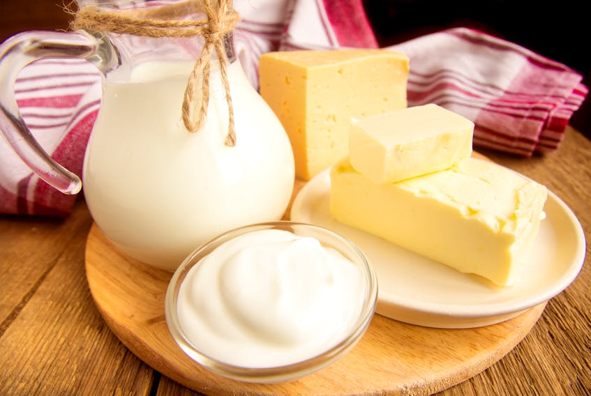 Dairy products - milk, cheese, butter, sour cream over wooden table. www.123rf.com