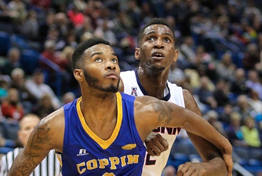 Arnold (A.J.) Fripp, left, boxes out a player during his days at Coppin State in Maryland. Submitted photo