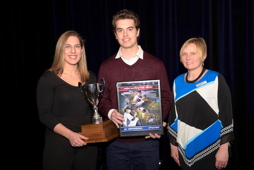 Baseball’s J. P. Stevenson, middle, is flanked by Niki Triantafillou from Synergy Fitness and Nutrition, left, and Sport P.E.I. board member Janet Clark at the recent Sport P.E.I. awards in Charlottetown. Stevenson, a New Glasgow native, won his second intercollegiate athlete of the year award.