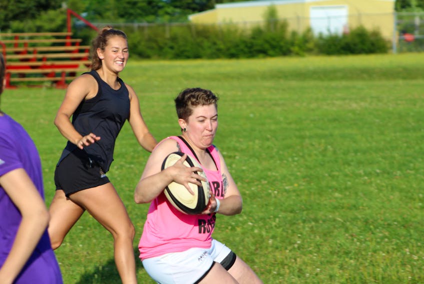 Charlottetown Rugby Football Club (CRFC) flanker Katie Perry takes a pass in a drill at a recent practice in Charlottetown. CRFC hosts the rival Halifax Tars in Nova Scotia Rugby Tier A women’s action today at 3:30 p.m. at Co-op Field in Charlottetown.