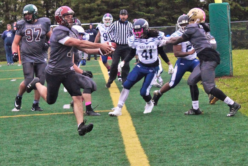 The Island Mariners Brennan Davis runs into the end zone for a touchdown against the Halifax Harbour Hawks in recent Maritime Football League action in Cornwall.