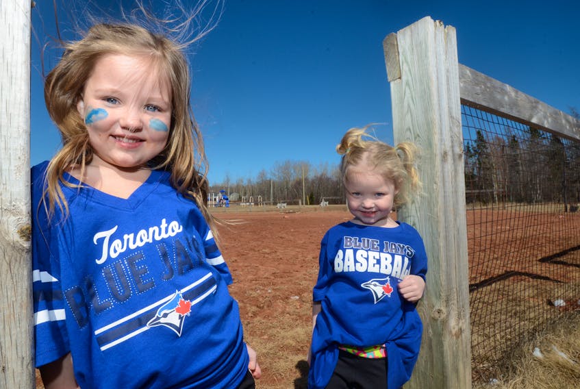 Rilynn MacKinnon, 5, and her three-year-old sister Kinsley are excited to play on the new ballfield in Scotchfort.