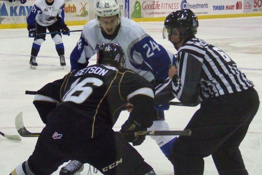 Cedric Parre (24) of the Saint John Sea Dogs faces off against Keith Getson of the Charlottetown Islanders in Quebec Major Junior Hockey League action Thursday in Charlottetown. The Isles won 3-2.
Charles Reid/The Guardian
