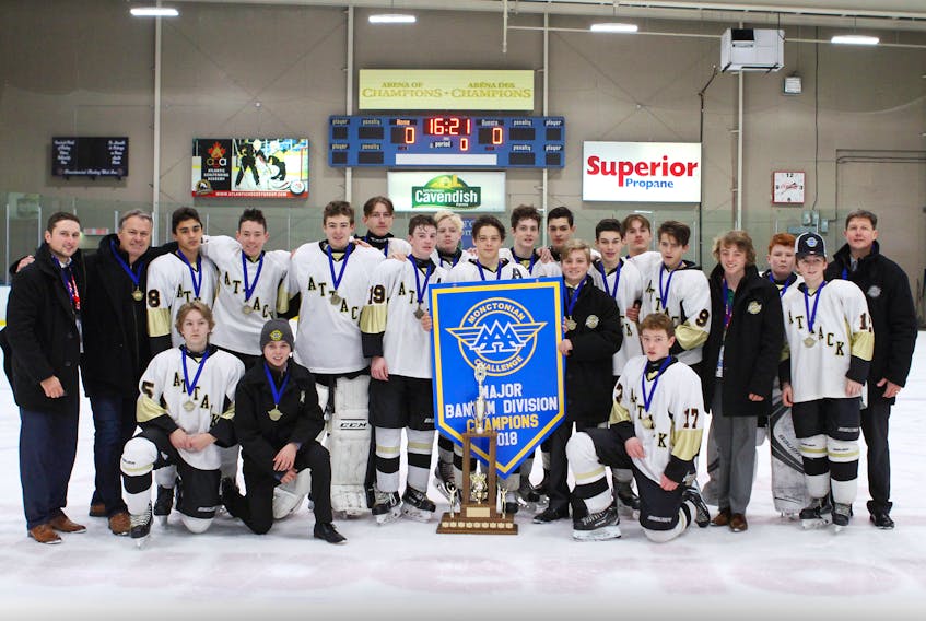 The Central Attack defeated the Rangers from East Hants, N.S., 2-1 in triple overtime Sunday to win the Monctonian’s major bantam division. Team members, front row, from left, are Keegan Callaghan, Brett Arsenault and Bates Ling. Second row, assistant coach Chris Hedefine, head coach Jeff Squires, Chris Koughan, Luke Coughlin, Jack Howatt, Damian Boyle, Colby Huggan, Max Sentner, Isaac Vos, Kal White, Will Morrison, Jamie Collins, Nathan Mossey, Tyler Worth, Jonah MacDonald, Landon MacDonald, Shannon MacDonald, Cam Squires and assistant coach K.J. White. (Gilles Thibodeau/Special to The Guardian)