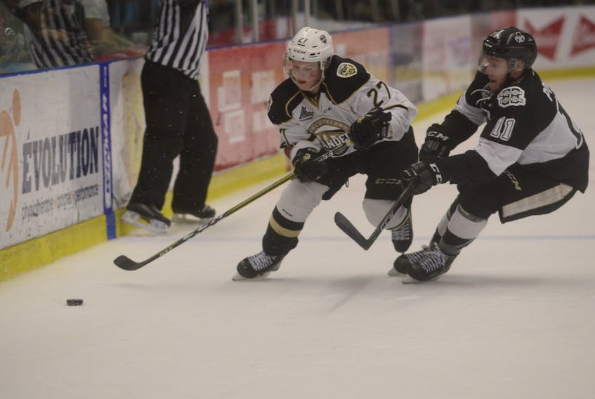 Charlottetown Islanders right-winger Derek Gentile, left, tries to get past Blainville-Boisbriand Armada forward Anthony Poulin during the second period of Tuesday's Game 7 in Boisbriand, Que.