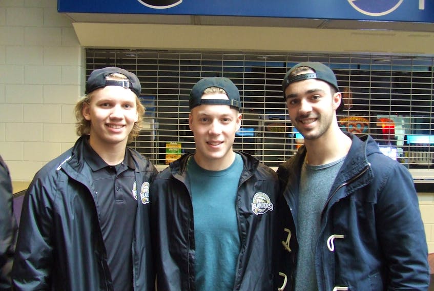 Nikita Alexandrov, left, Matthew Welsh, centre, and Pascal Aquin, of the Charlottetown Islanders were at the Quebec Major Junior Hockey League team’s season wrap-up party Thursday at the Eastlink Centre. Alexandrov, 17, and Welsh, 18, return next season, but Aquin, 20, graduates from major junior and won’t return.