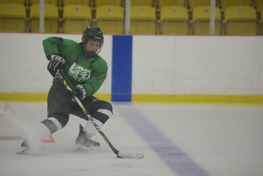 Kaylee Dufresne controls the puck while going through a drill during a UPEI Panthers practice. The team starts their Atlantic Unviersity Sport women’s hockey regular season tonight at MacLauchlan Arena.