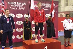 North Winsloe native Veronica Keefe, centre, stands on the podium after winning Canada’s lone gold at the recent senior Pan American wrestling championships in Lima, Peru. Keefe defeated Diana Cruz Arroyo, far right, of Peru to win the title. Silver went to American Hannah Gladden, left.