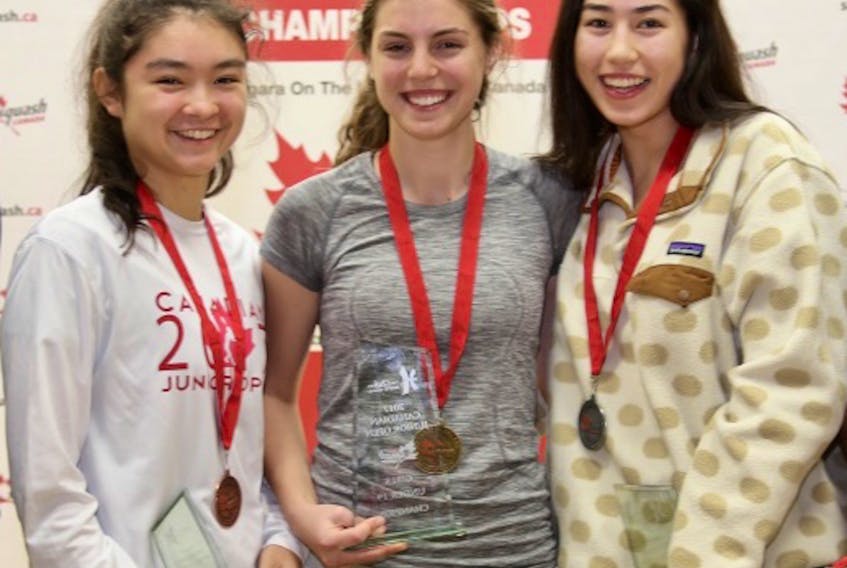 Stratford native Emma Jinks, centre, holds her trophy and and displays her gold medal after winning the under-19 girls division at the recent Canadian Junior Open squash tournament in Niagara-on-the-Lake, Ont. Jinks beat British Columbia’s Andrea Michele Toth, right, 3-1 (12-14, 11-7, 11-5, 11-6) in the final and B.C.’s Brooke Herring, left, 3-1 (11-9, 13-15, 11-3, 11-6) in the semifinals. It was Jinks’ first international tournament win. The Open drew 273 athletes from 23 countries.