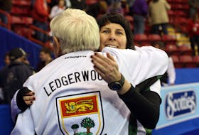 Kathy O’Rourke and coach Al Ledgerwood celebrate after Team P.E.I. won its semifinal game and advanced to the final of the 2010 Scotties Tournament of Hearts Canadian women’s curling championship in Sault Ste. Marie, Ont. Rachele Labrecque/Sault Star