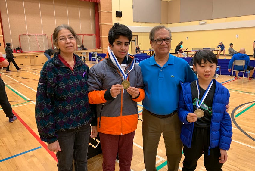 P.E.I.’s table tennis team brought home four medals from a tournament in Musquodoboit this week in Nova Scotia. From left, are Farida Chishti manager; Zaeem Arif, gold medal in Division F; coach Najam Chishti; and Mike Li, silver medal winner in Division E.
