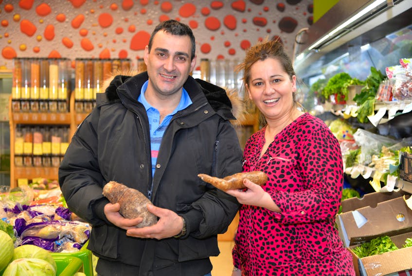 Burhan Kaboush, left, and his wife Luba are the owners of Freshest Fruits and Vegetables on University Avenue in the space previously occupied by the Needs convenience store. Freshest offers local produce as well as international produce that is hard to find on P.E.I. In this photo, Burhan is holding a Taro Root while Luba is holding a Yoka Cassava.