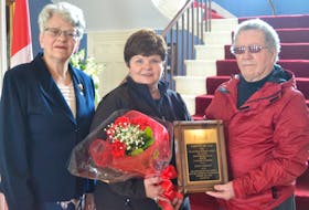P.E.I. Lt.-Gov. Antoinette Perry, left, welcomes Linda Gallant, MS Society Person of the Year for 2018 to Fanningbank in Charlottetown. At right is Don Bell, chairman of P.E.I. chapter of MS Society of Canada. They were visiting Perry at a recognition event for May, which is MS Awareness Month in the province. -Guardian photo