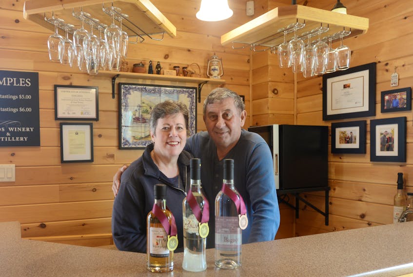 Heather and Jamie Matos show their award-winning products, from left, Anisette, P.E.I. Apple Brandy and Bagaco. The couple recently won two gold medals and a bronze in the Canadian Artisan Spirit competition in British Columbia and are preparing for the upcoming summer season.