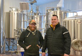 Chef Dave Mottershall, left, and Bogside Brewing owner David McGuire stand in front of some of the equipment at the Montague brewery, which is set to open this spring.