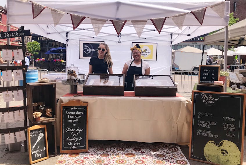 Jenna Kennan, left, and Via Reyes operate their businesses Vegabun and Mellow Dough side-by-side at the Downtown Charlottetown Farmers’ Market.