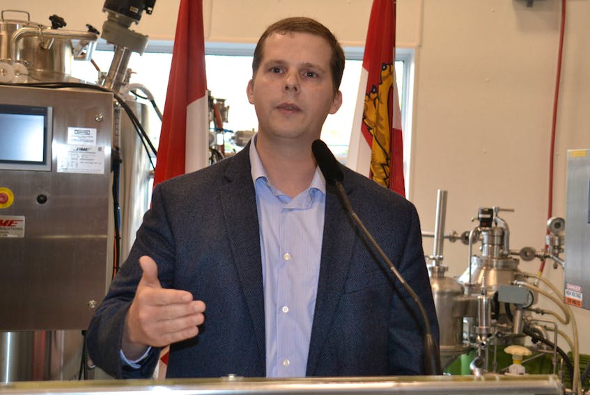 Jonathon Roepke, lead product development research scientist for MicroSintesis Inc., speaks to an audience in Charlottetown recently and explains the way new biotechnology equipment will help his employer develop products on a commercial scale.