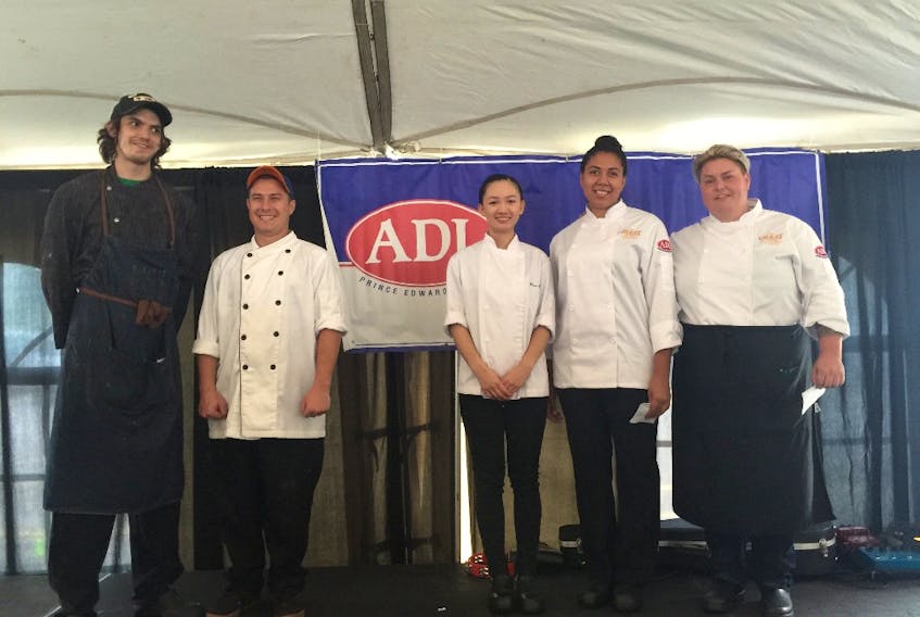 First-place winners chef Craig Doucette and chef Andre Boucher, both from Mavors, join second-place winners chef Diem Bui and chef Tyra Russel from Papa Joe's and third-place/People's Choice winner Jane Crawford of the HopYard during the recent 2017 Great Island Grilled Cheese championship.