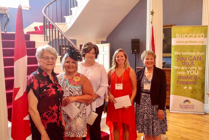 Lt.-Gov. Antoinette Perry, from left, hosted P.E.I. Business Women’s Association micro-grant winners Krista MacLeod, Jackie Herbert and Suzanne Scott along with BWA executive director Margaret Magner at a recent Fanningbank reception for the organization. Micro-grant winner Amber Jadis was unable to attend.
