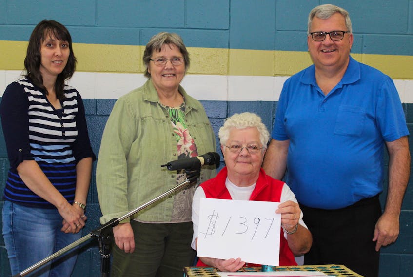 A family benefit Mega-Bingo in Abram-Village raised $1,397 to help out the Summerside Salvation Army Food Bank and the Tyne Valley Caring Cupboard. From left, Diane McInnis representing Evangeline-Central Credit Union, Angèle Arsenault, representing Wellington Co-op and Raymond J. Arsenault, representing RDÉE P.E.I. and the Acadian and Francophone Chamber of Commerce of P.E.I., with Sr. Norma Gallant of the Coopérative de communication communautaire, as they jointly announced the amount that had been raised for the cause.
