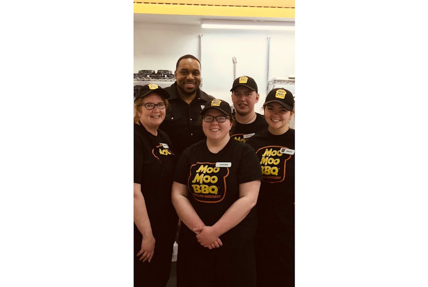 From left, Sheela Brennan, director of operations for Moo Moo BBQ; Terrance Hill, pitmaster from Dallas, Texas; Karianne MacDonald, manager of Moo Moo BBQ; Dylan Cameron, pitmaster; and Kailyn Sherren, assistant manager, pose for a photo during Hill’s trip to P.E.I.