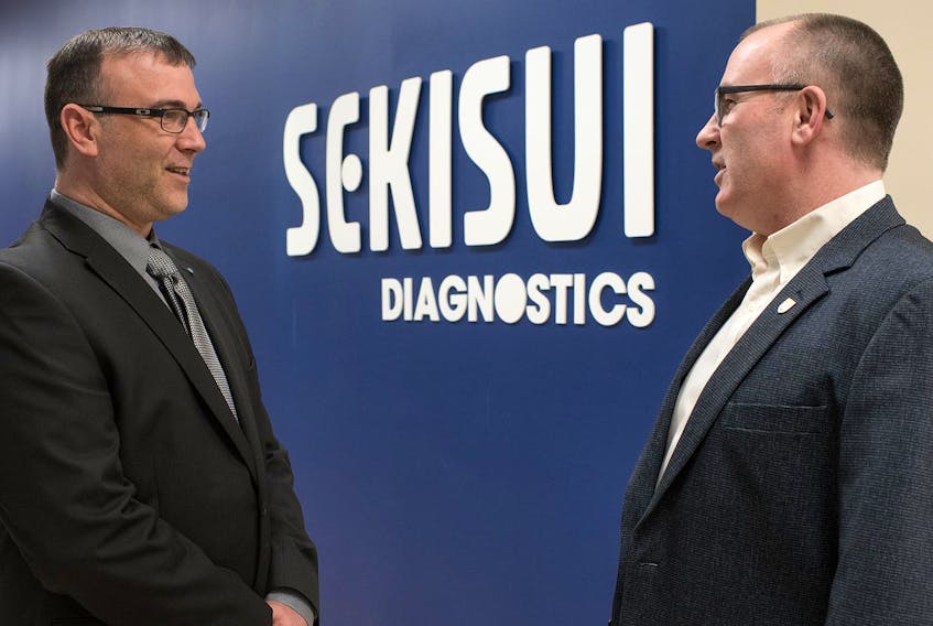 Minister of Economic Development and Tourism Chris Palmer, right, chats with Sekisui plant manager Eugene Howatt at a recent visit to the company's facility in the West Royalty Business Park.