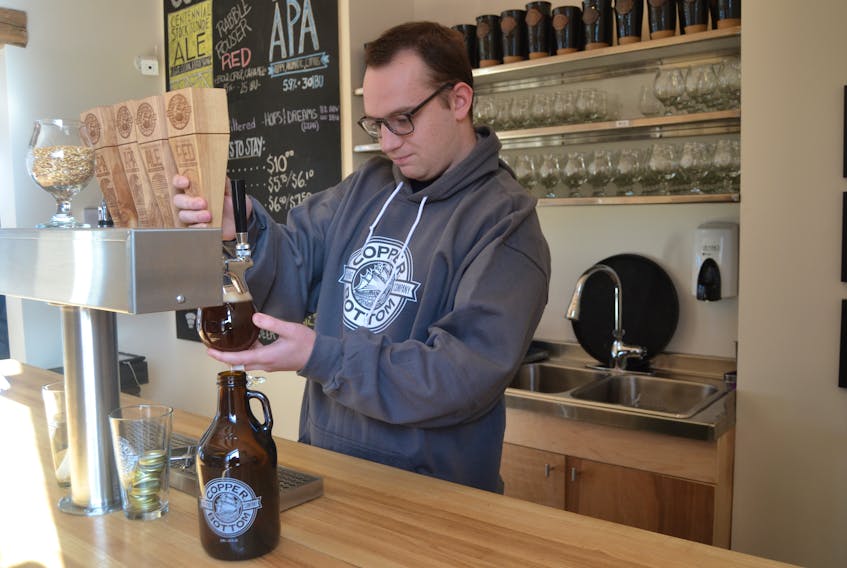 Isaac MacIntyre pulls a pint of Rabble Rouser Red, a beer named in honour of the late Jim MacNeill at Copper Bottom Brewing in Montague. The brewery and taproom, located in the historic Eastern Graphic Building, is preparing to launch another new beer in early March.